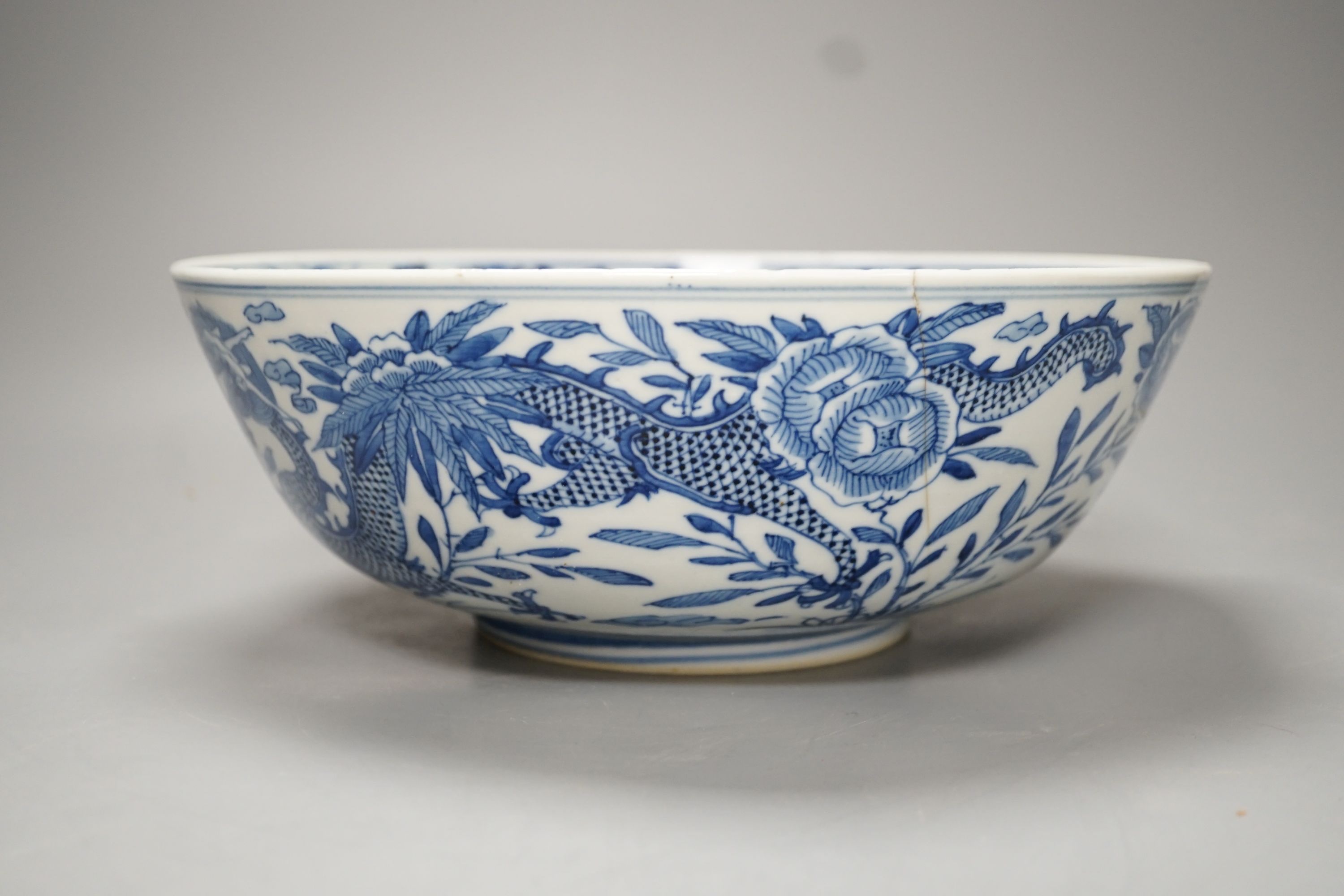 A 19th-century Chinese blue and white ‘dragon’ bowl - 27cm diameter